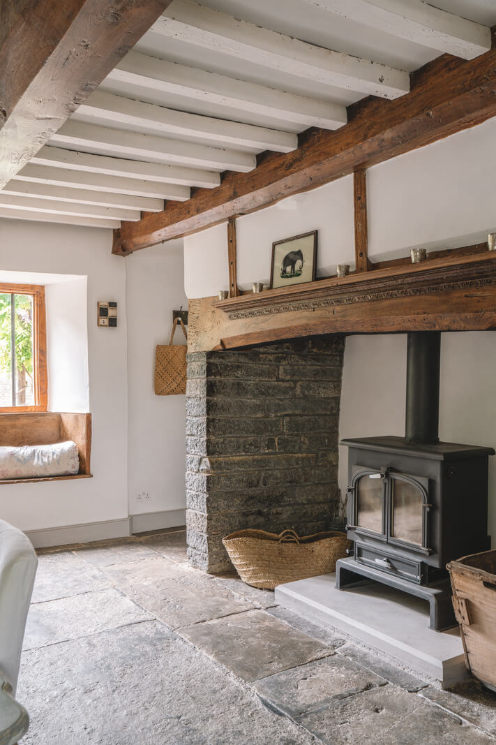 A Beautiful Renovated Country House in England 11 dining room fireplace and window seat
