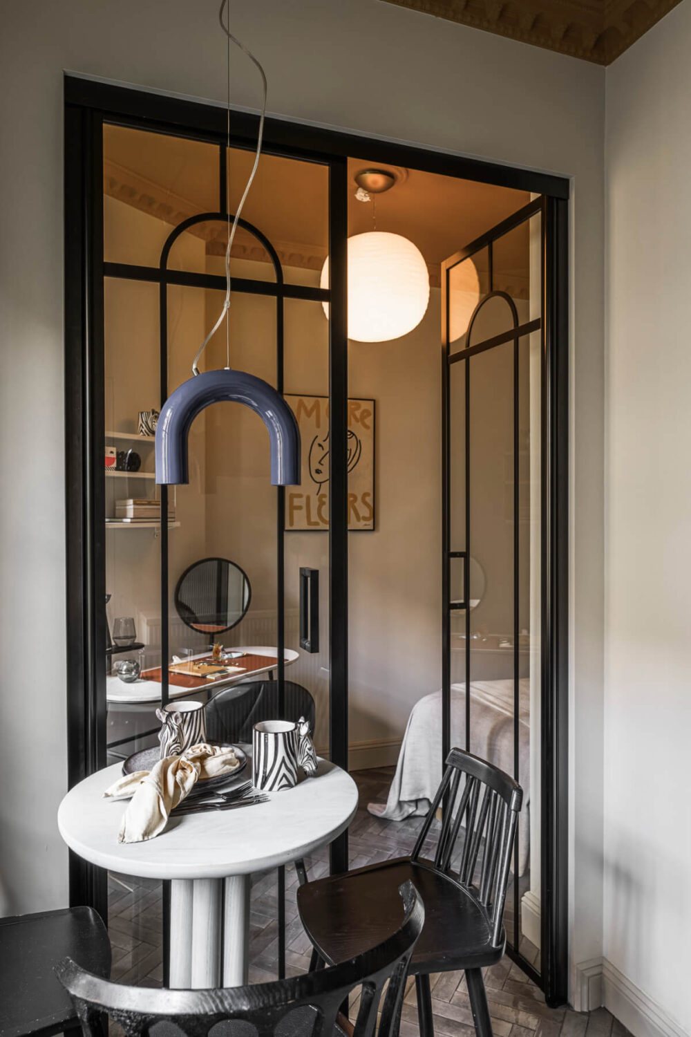 A Swedish Apartment with Exclusive Materials and Monochrome Color Scheme 11 glass industrial door to bedroom