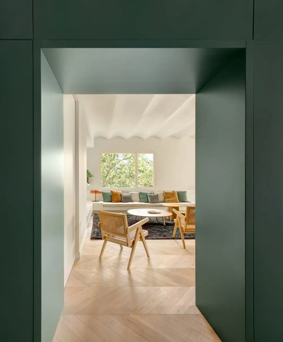 A Modern Barcelona Apartment with a Pink Bathroom 1 green doorway