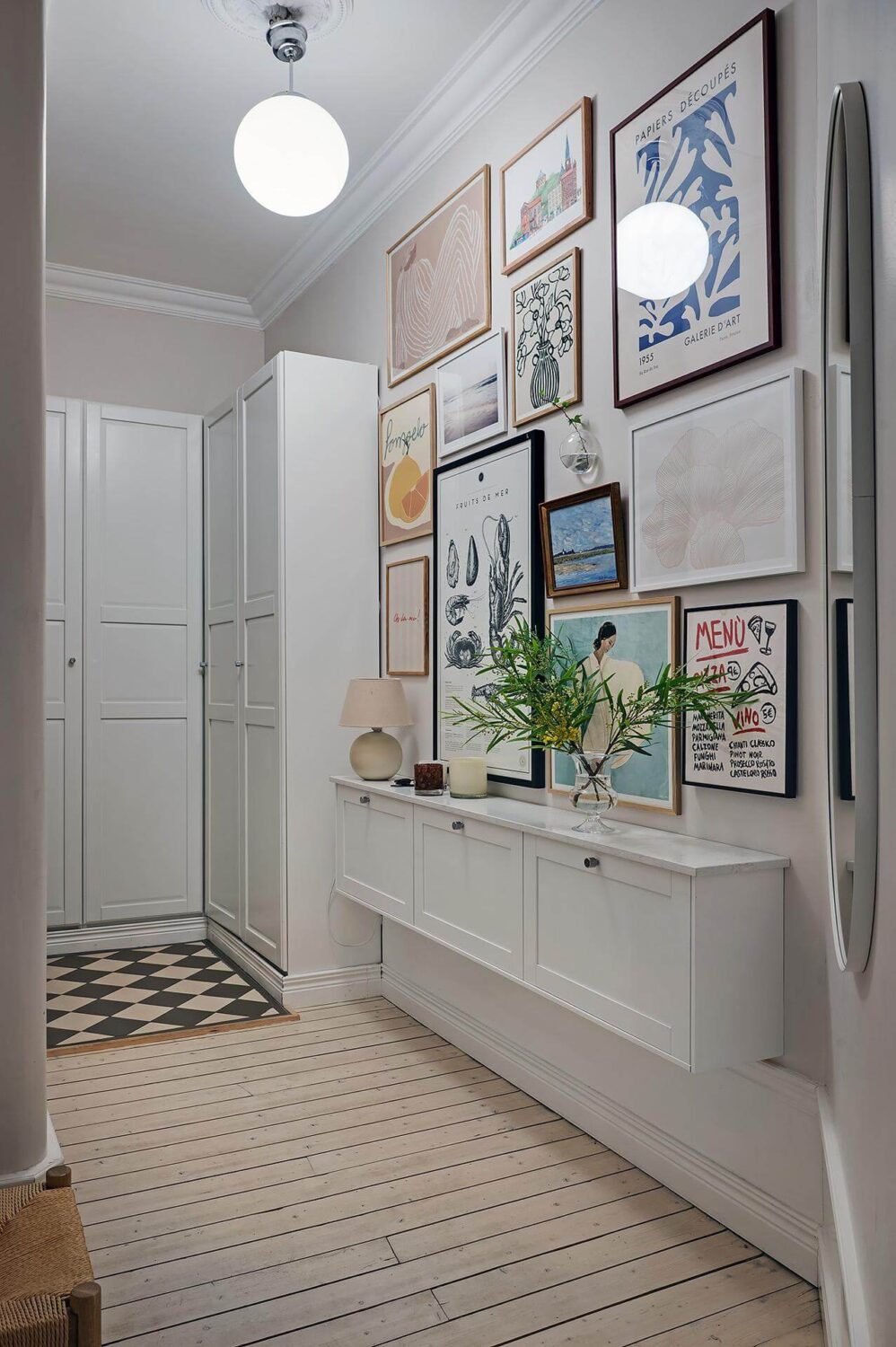 Period Features and Modern Materials in a Swedish Apartment 32 hall gallery wall wooden floor floating cupboards