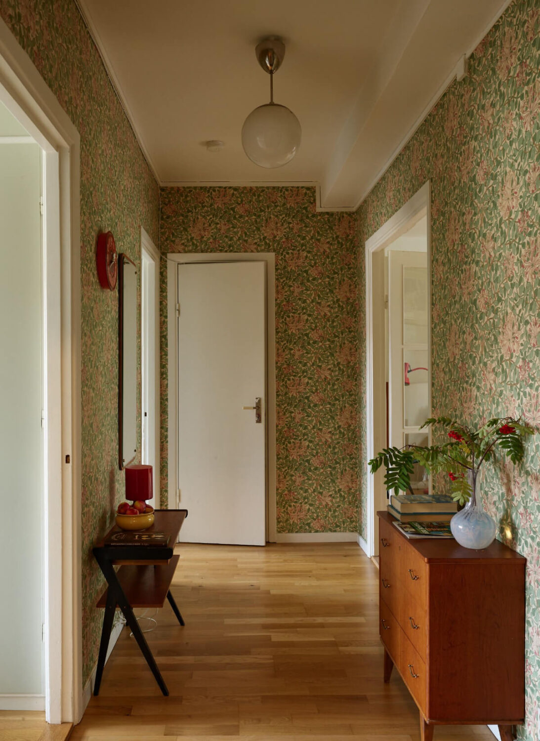 A Charming Midcentury Apartment with Original Features 9 hall william morris wallpaper