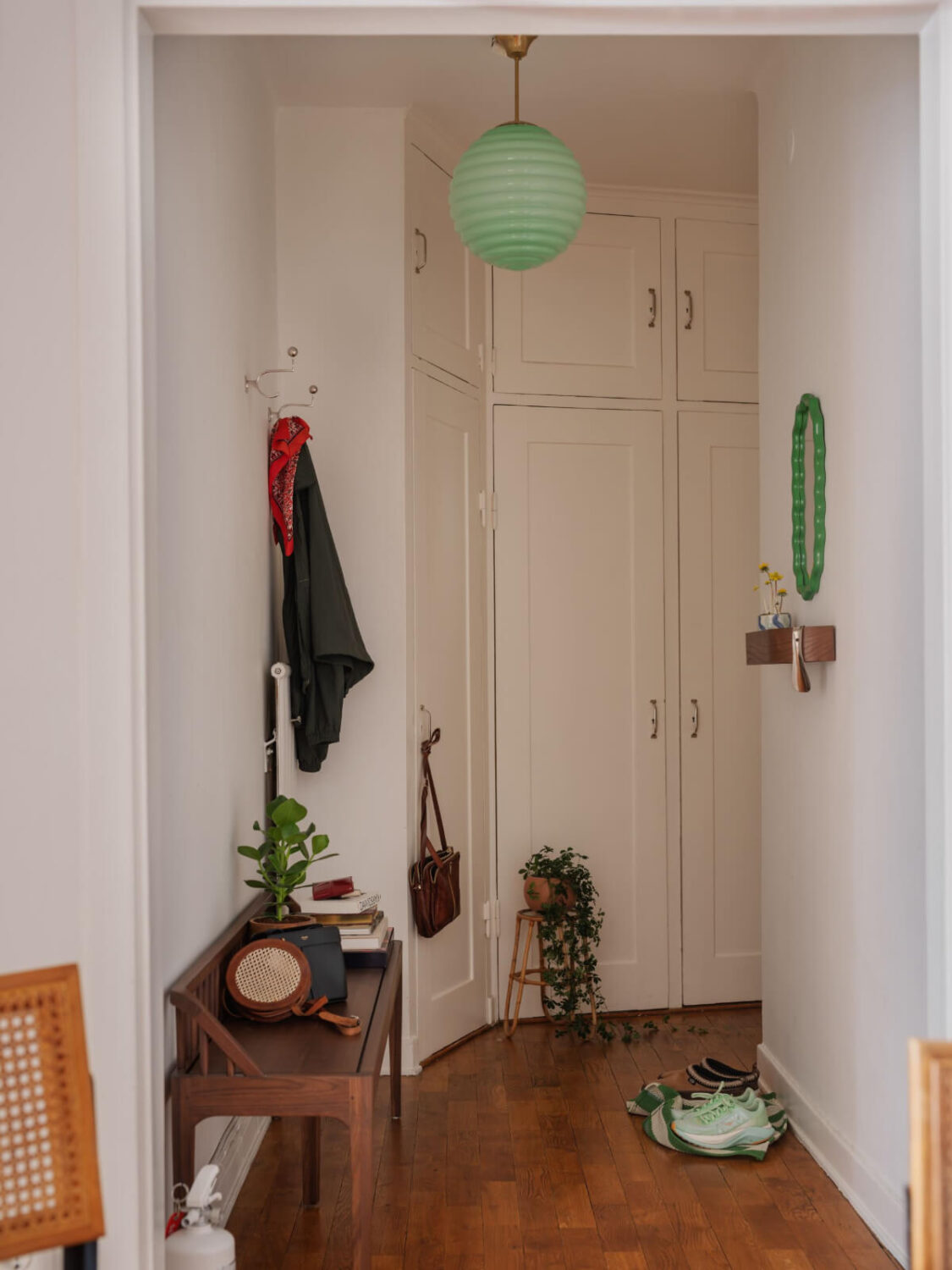 An Airy One-Bedroom Apartment with Art and A Yellow Kitchen 22 hall with built in wardrobes An Airy One-Bedroom Apartment with Art and A Yellow Kitchen
