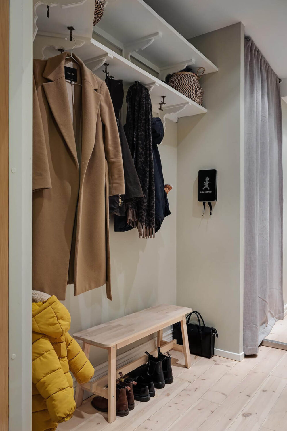 A Swedish Apartment with an Open Living Space and Period Features 30 hallway with shelves and coat hangers A Swedish Apartment with an Open Living Space and Period Features