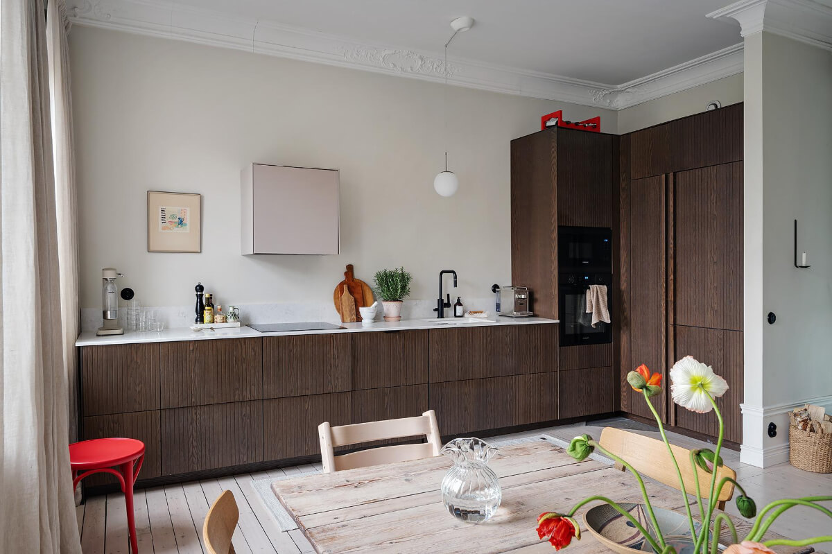 Period Features and Modern Materials in a Swedish Apartment 11 kitchen dark stained ash veneer cupboards