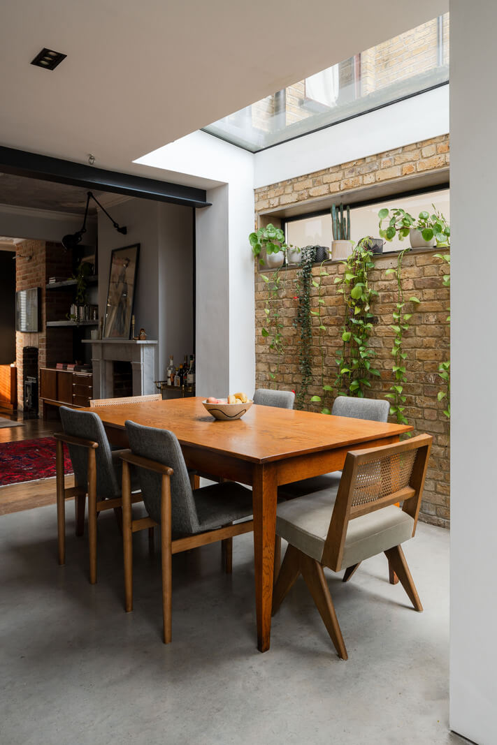 A Restored Victorian House with Exposed Brick and a Kitchen Extension 5 kitchen dining table brick wall skylight