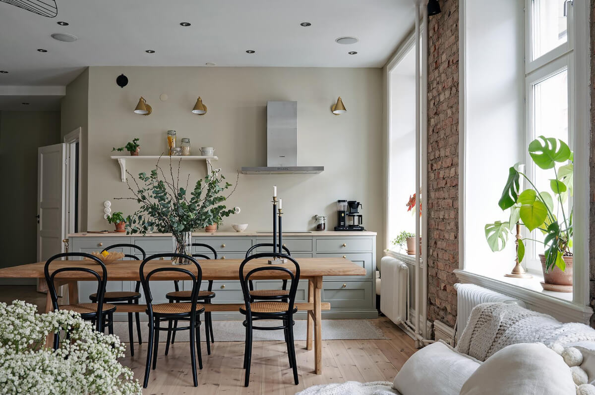 A Swedish Apartment with an Open Living Space and Period Features 9 kitchen large wooden table