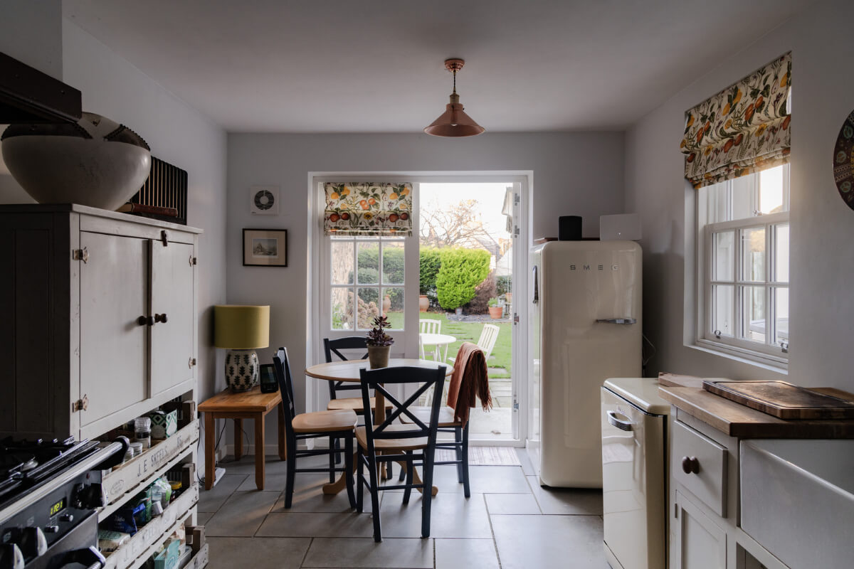 A Georgian English House Restored To Its Former Glory 5 kitchen with stone floor and garden doors