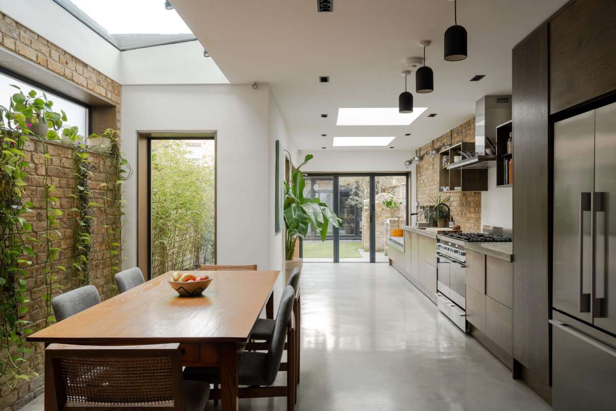 A Restored Victorian House with Exposed Brick and a Kitchen Extension 8 large extended kitchen with brick walls and skylights