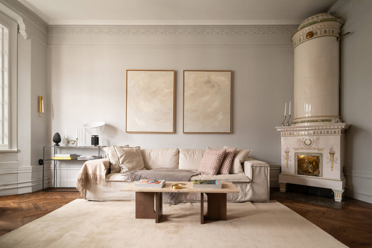Beautiful Period Features in a One-Bedroom Stockholm Apartment 2 light gray living room large fireplace