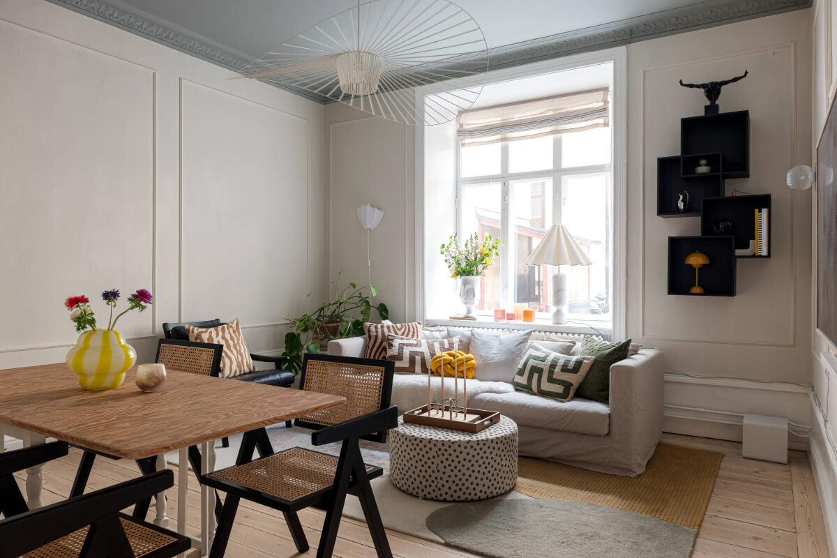 An Elegant Stockholm Apartment with a Pink and Black Kitchen 1 living room gray painted ceiling