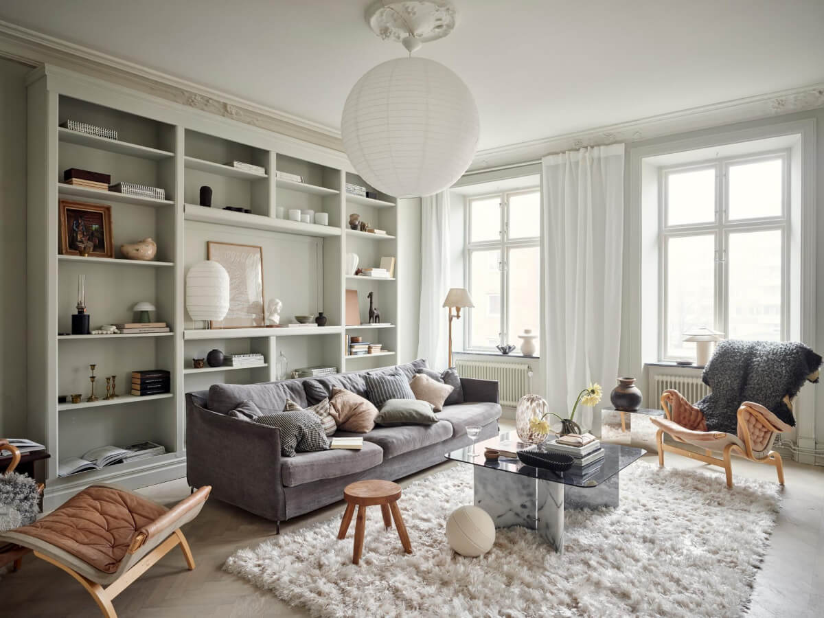 A Light Scandi Apartment in a Former Stately Home 1 living room with custom bookcases