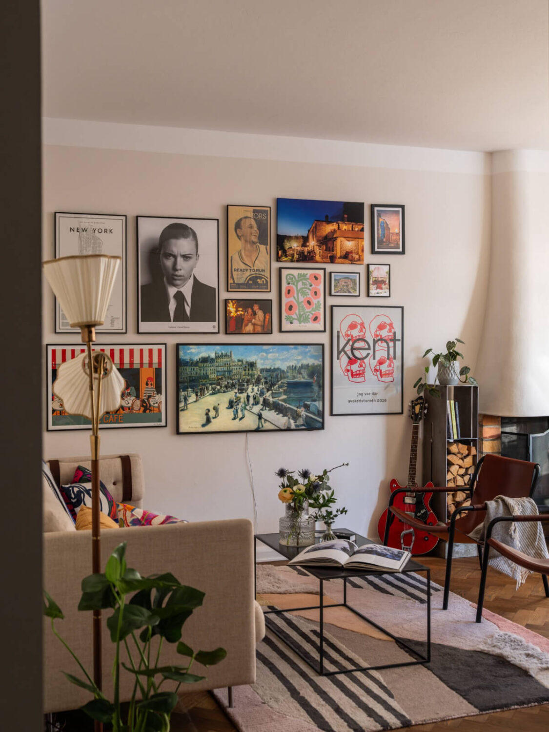 A Light, Renovated Two-Bedroom Apartment in Stockholm 1 living room with gallery wall
