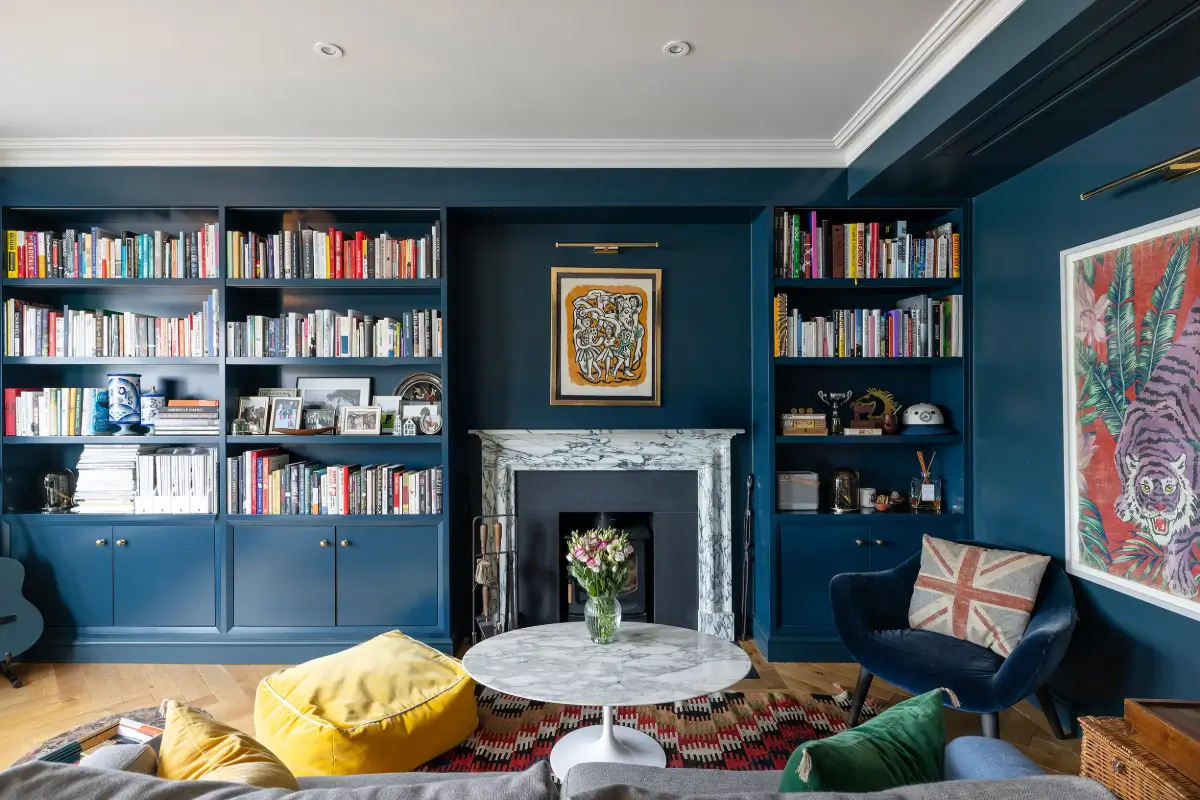 A Beautiful Duplex Apartment in a Notting Hill Townhouse 1 marble fireplace flanked by bookcases