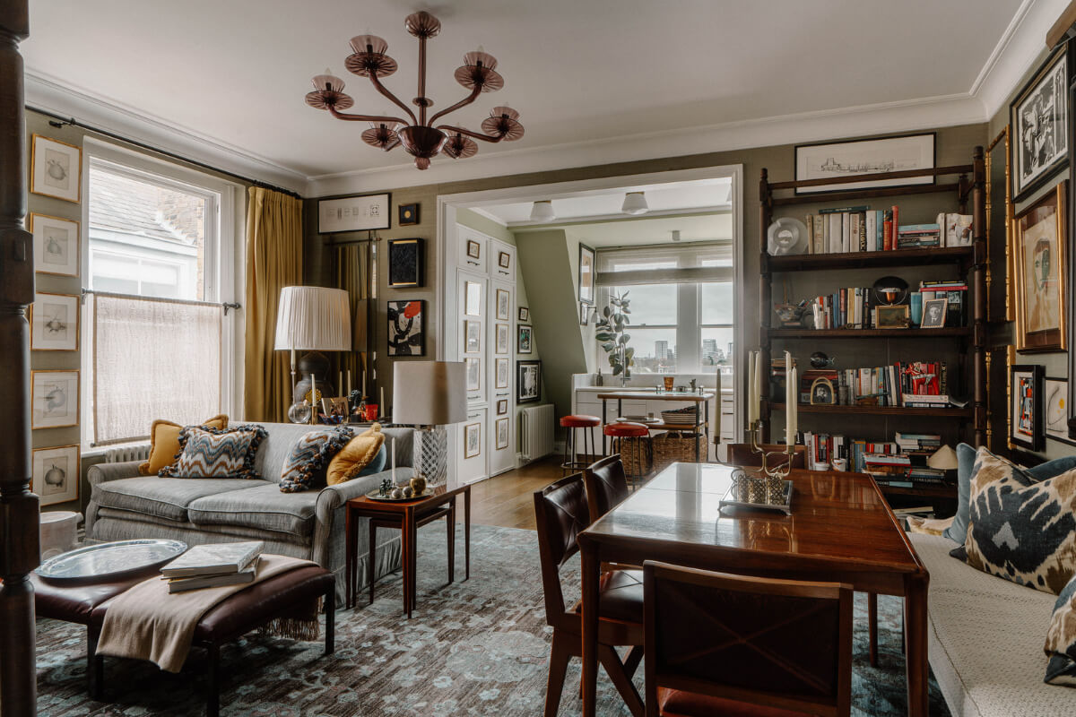 A Cozy Art-Filled Attic Apartment in London 1 open plan living space with layered textiles and dining table