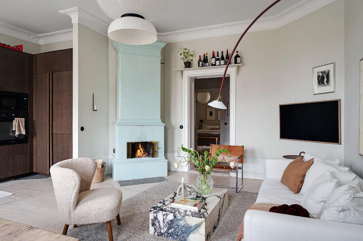 Period Features and Modern Materials in a Swedish Apartment 6 pale blue fireplace living room