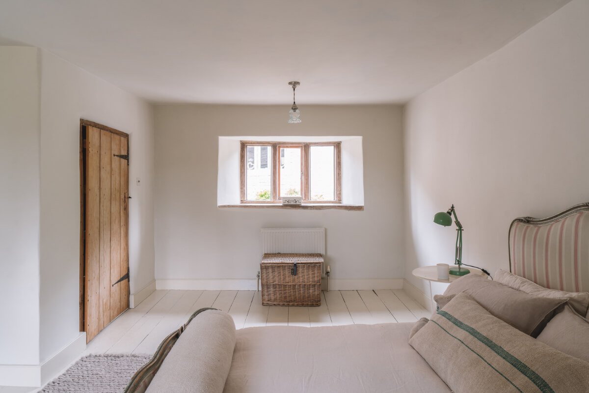 A Beautiful Renovated Country House in England 27 serene bedroom rustic wooden door
