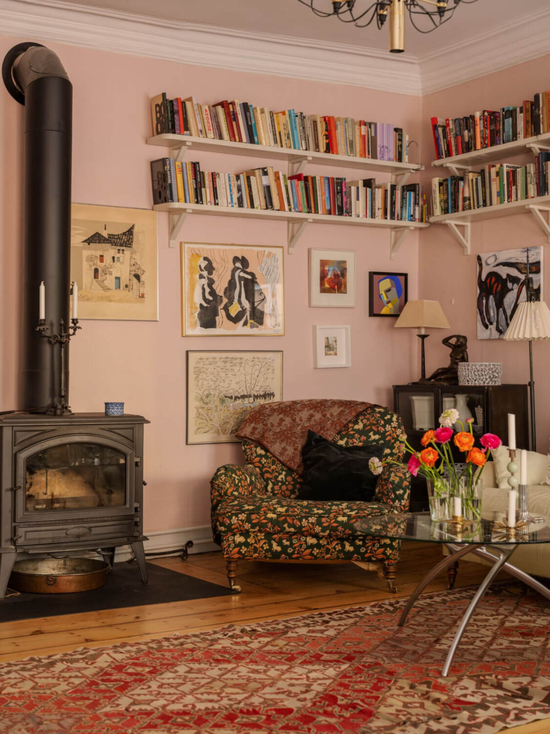 A Charming Home in a 17-Century Apartment in Stockholm's Old Town 3 sitting room with bookshelves wood burner