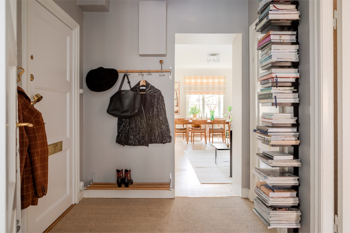 A Light-Filled Two Bedroom Apartment in Stockholm 21 spacious hall bookshelves A Light-Filled Two Bedroom Apartment in Stockholm