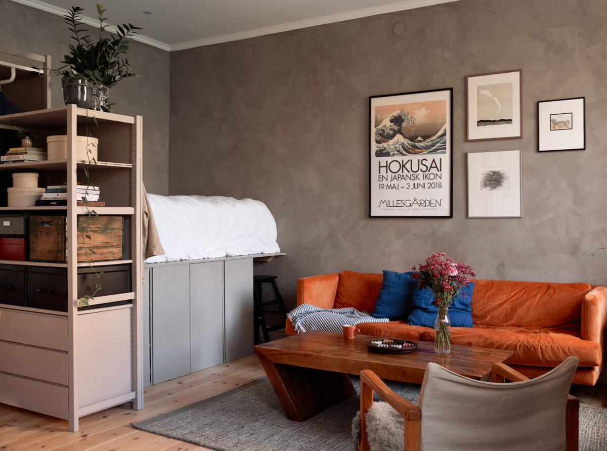 A Studio Apartment with Smart Storage Ideas and Exposed Brick 1 studio apartment raised bed