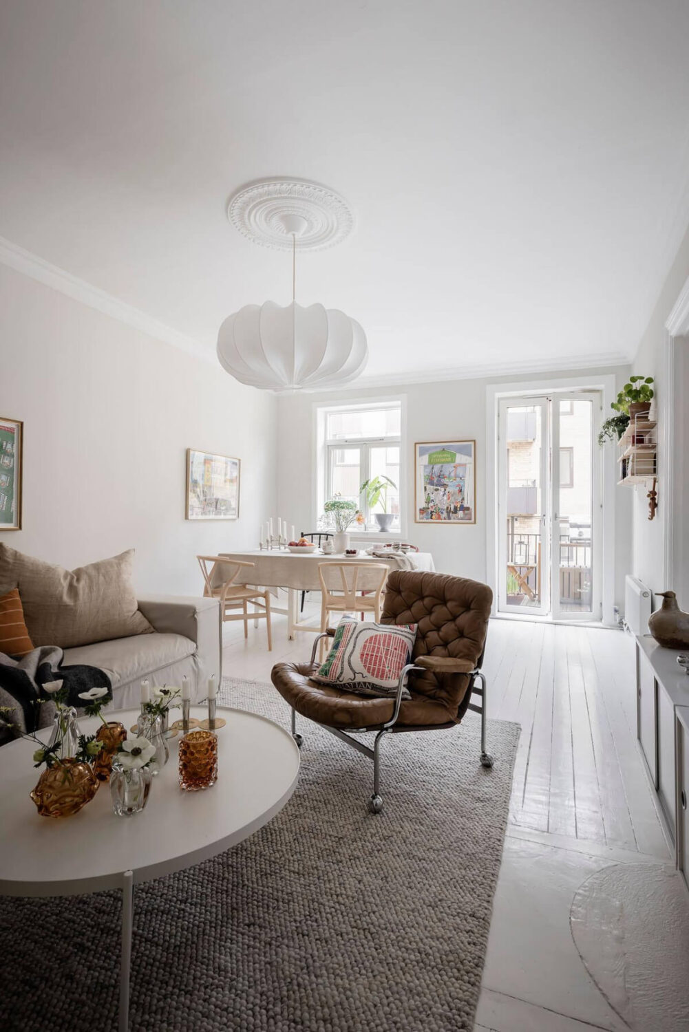 White-Painted Floorboards in a Turn-of-the-Century Apartment 6 white floorboards bright scandi living room