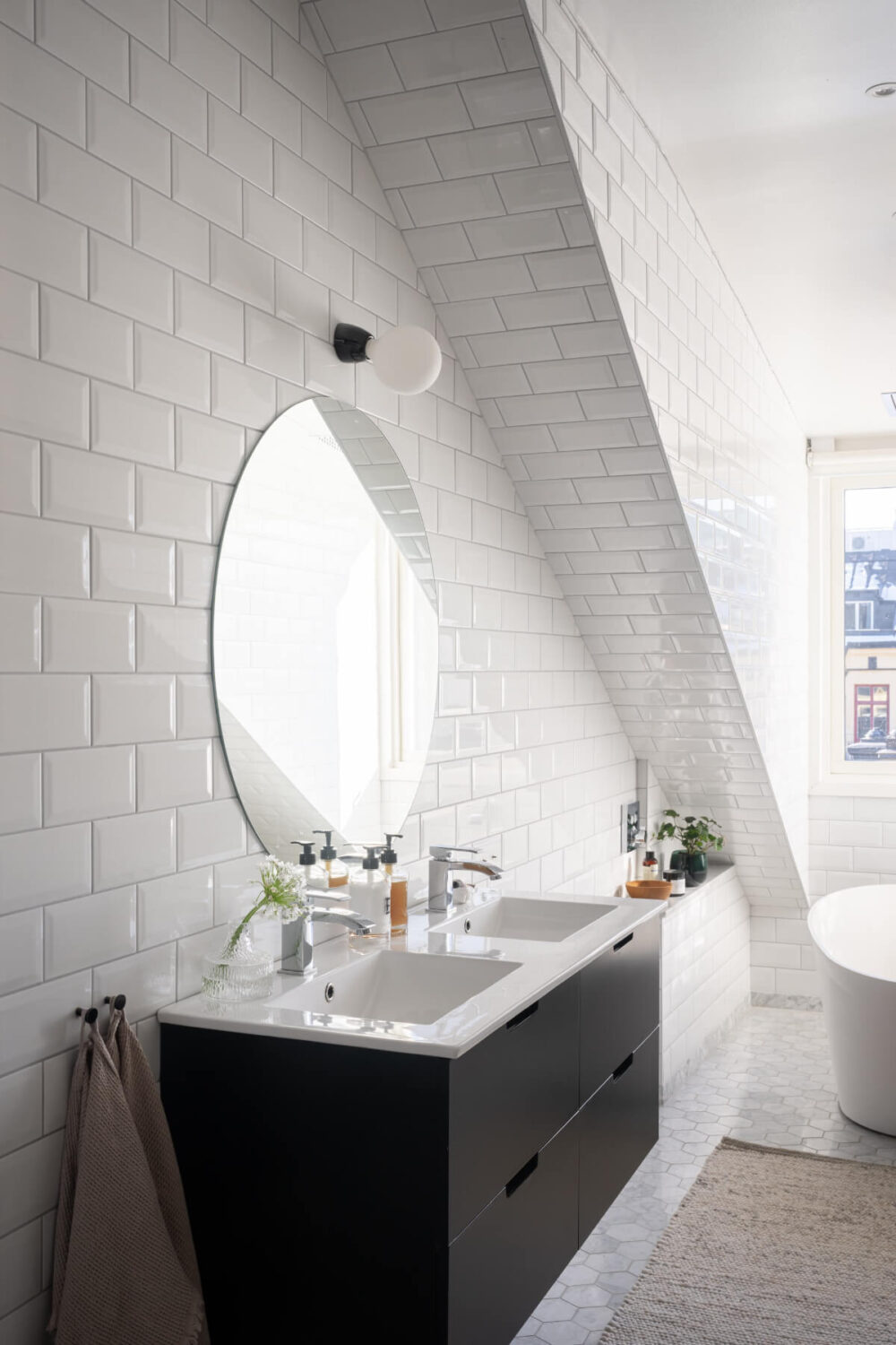 A Light Penthouse Apartment with Built-In Bookshelves 20 bathroom double sink large round mirror