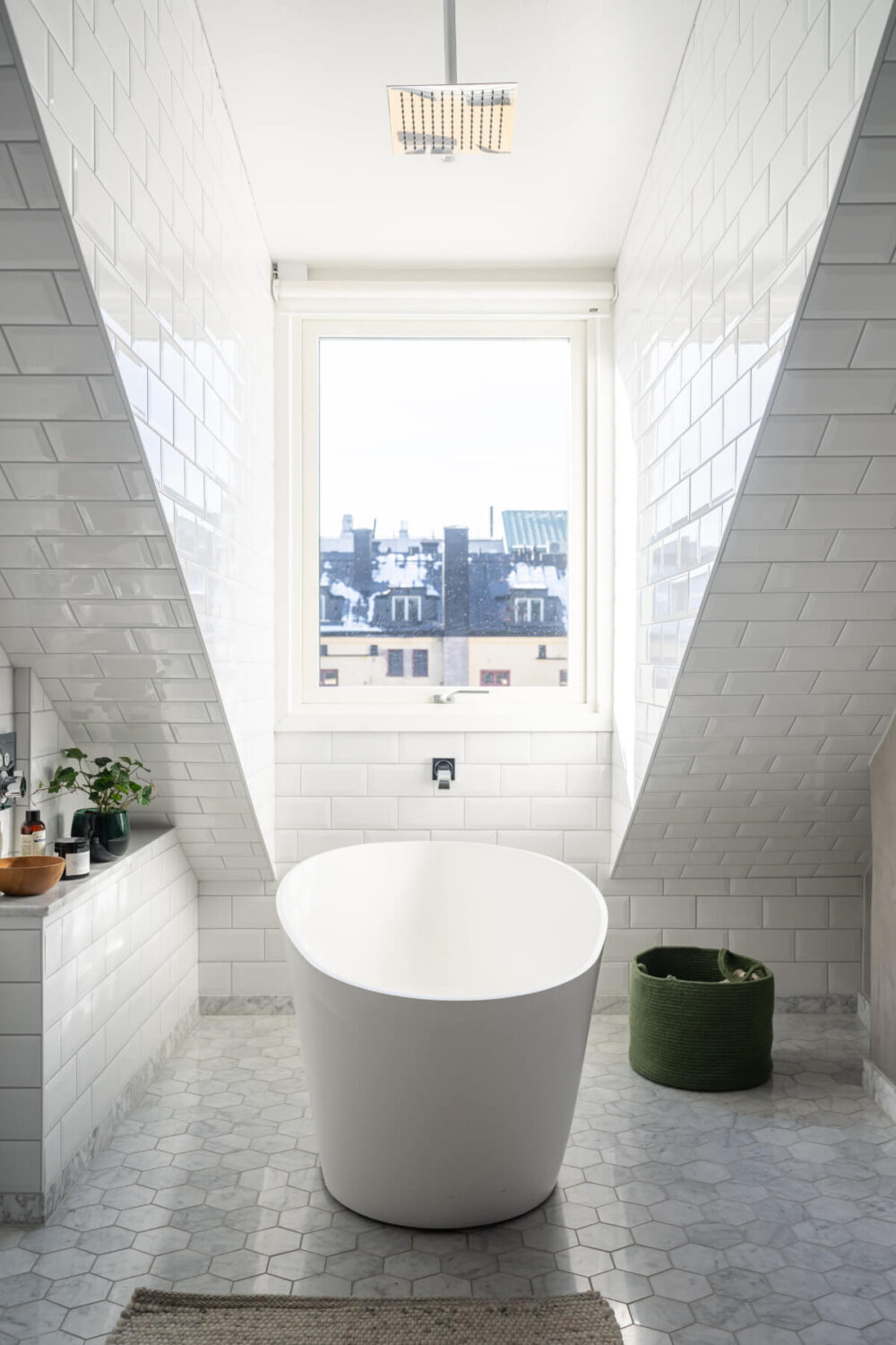 A Light Penthouse Apartment with Built-In Bookshelves 19 bathroom marble floor tiles freestanding bath