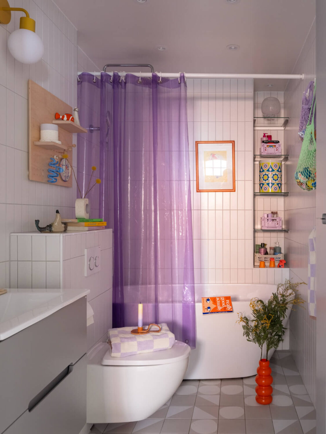 Colorful Decor in a Charming Family Duplex Apartment in Stockholm 29 bathroom purple shower curtain
