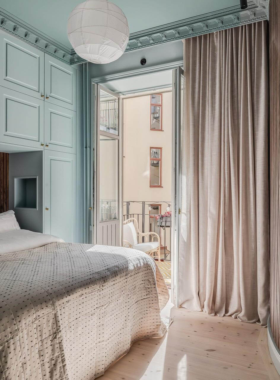 Pastel Colors and Contemporary Design in a Late 19th Century Apartment 15 blue bedroom with balcony