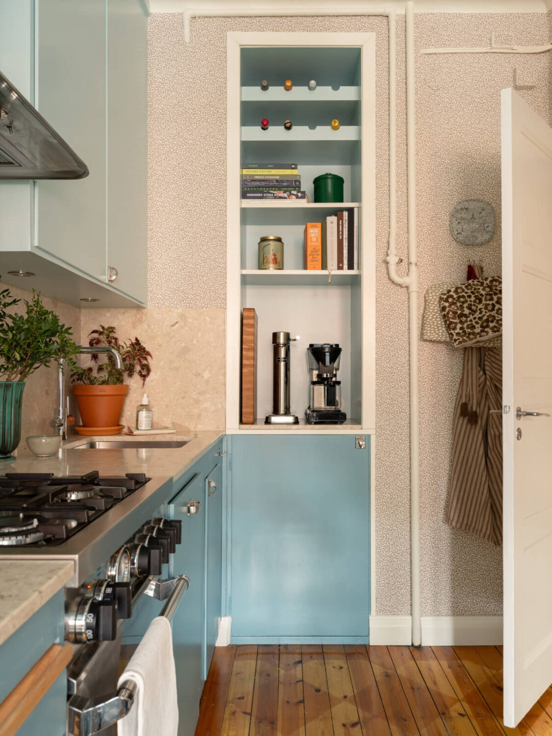 A Beautiful Well-Preserved 1930s Apartment with a Blue Kitchen 3 blue kitchen built-in shelves