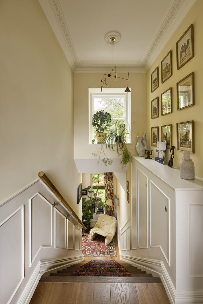 A Renovated Early Victorian Townhouse Decorated in Green Tones 19 dark beige staircase