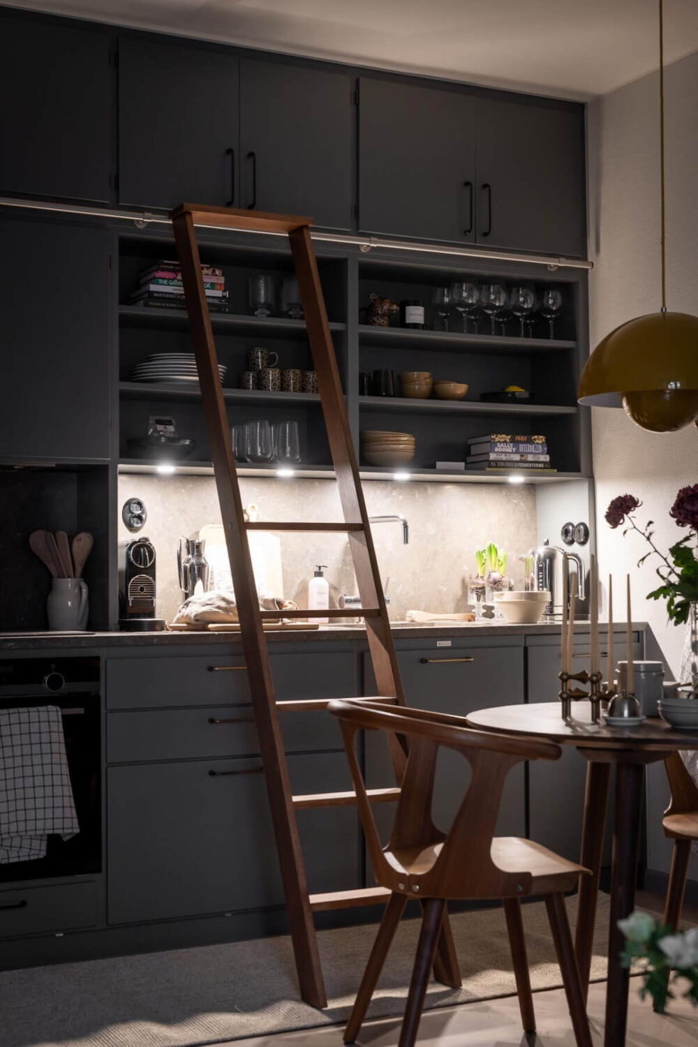 A Small Ground Floor Apartment Decorated in Gray Tones 9 gray kitchen with ladder