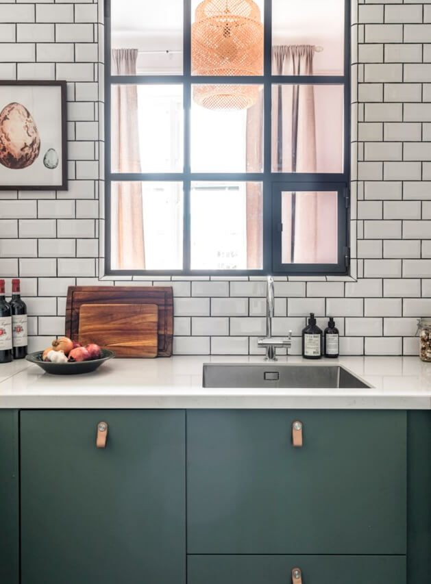 A Small Light-Filled Apartment with a Pink Bedroom 14 green kitchen cabinets inner window