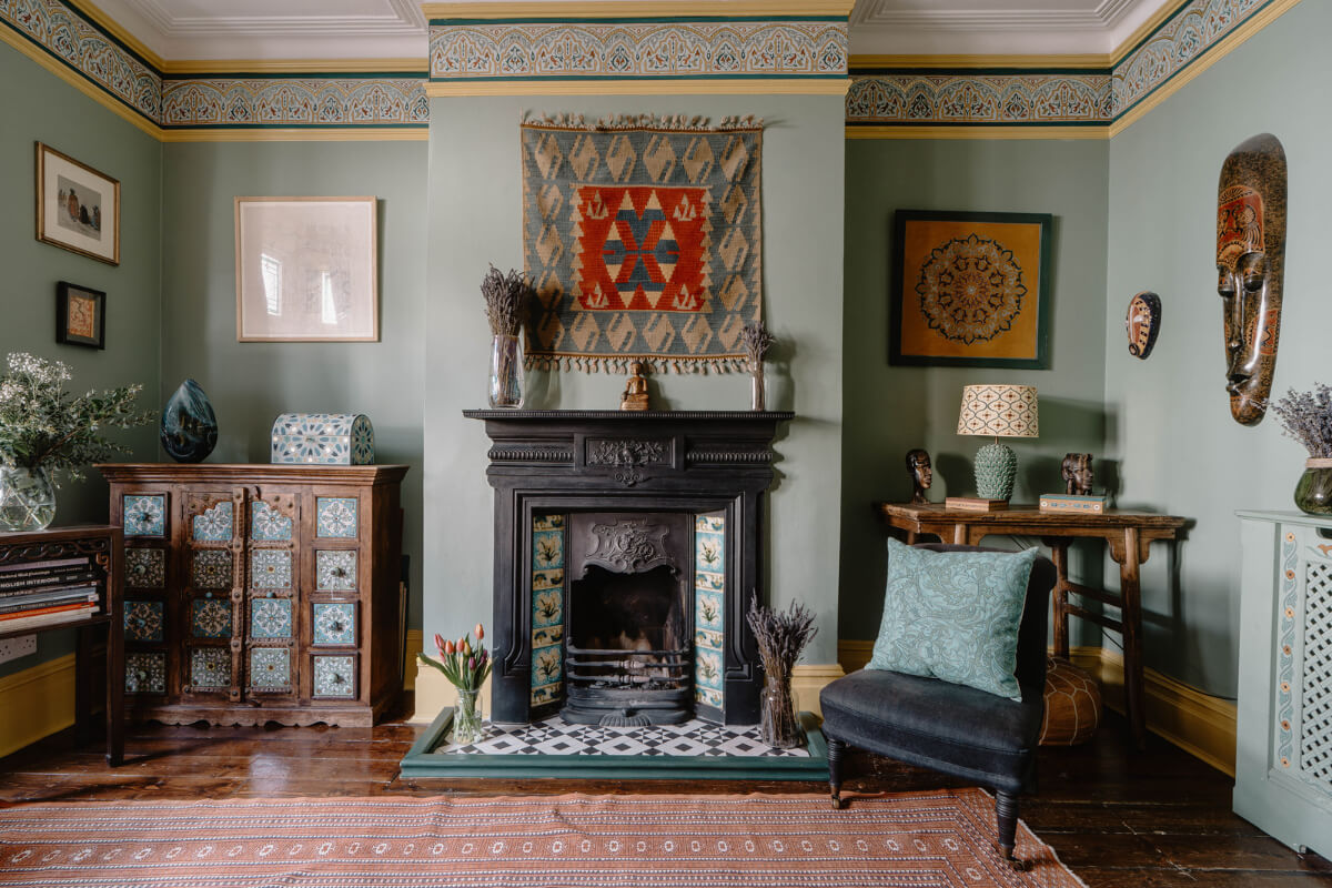 Moroccan-Inspired Designs in a Unique Artist Family Home in London 1 green sitting room edwardian fireplace