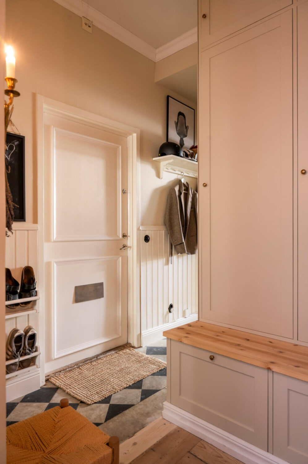 A Cozy Small Apartment with Period Features and Lots of Storage 25 hall built in wardrobes checkerboard tile floor