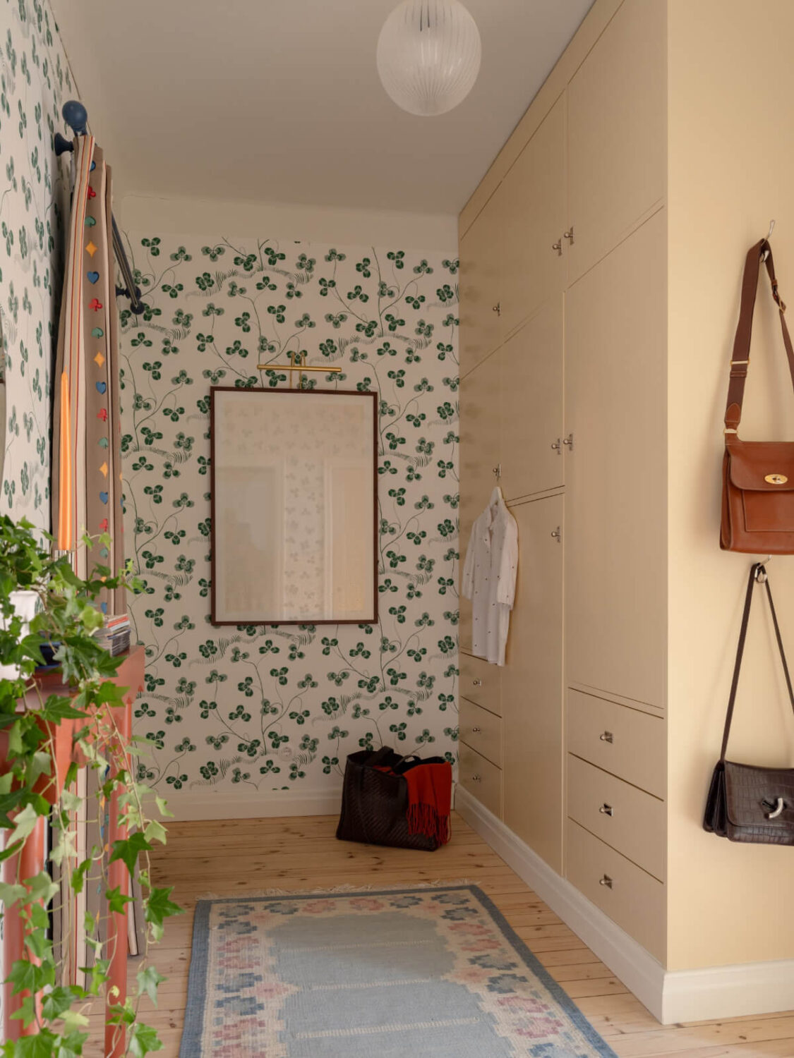 A Beautiful Well-Preserved 1930s Apartment with a Blue Kitchen 19 hall with built-in wardrobes and wallpaper