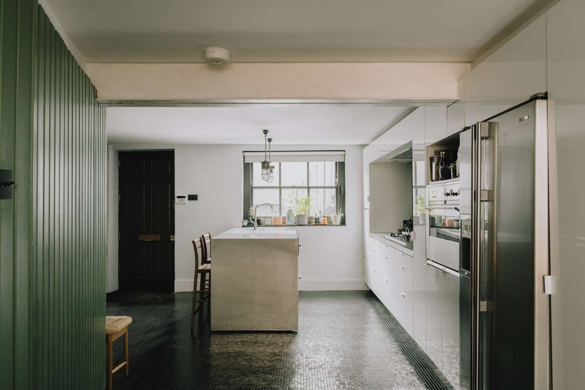 A London Basement Apartment in a Former Wood Workshop 11 kitchen dark mosaic floor tiles