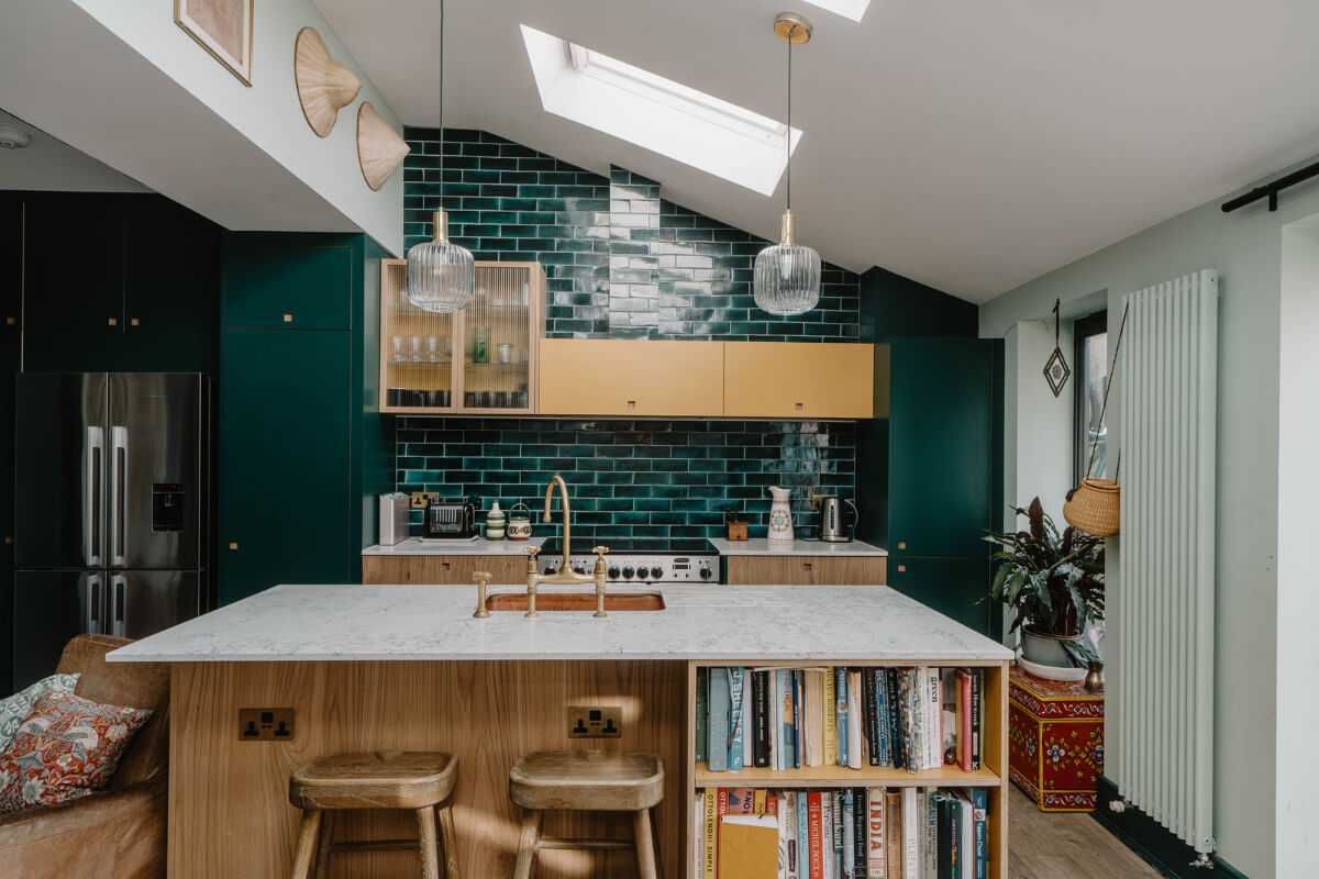 Moroccan-Inspired Designs in a Unique Artist Family Home in London 8 kitchen with island green backsplash tiles