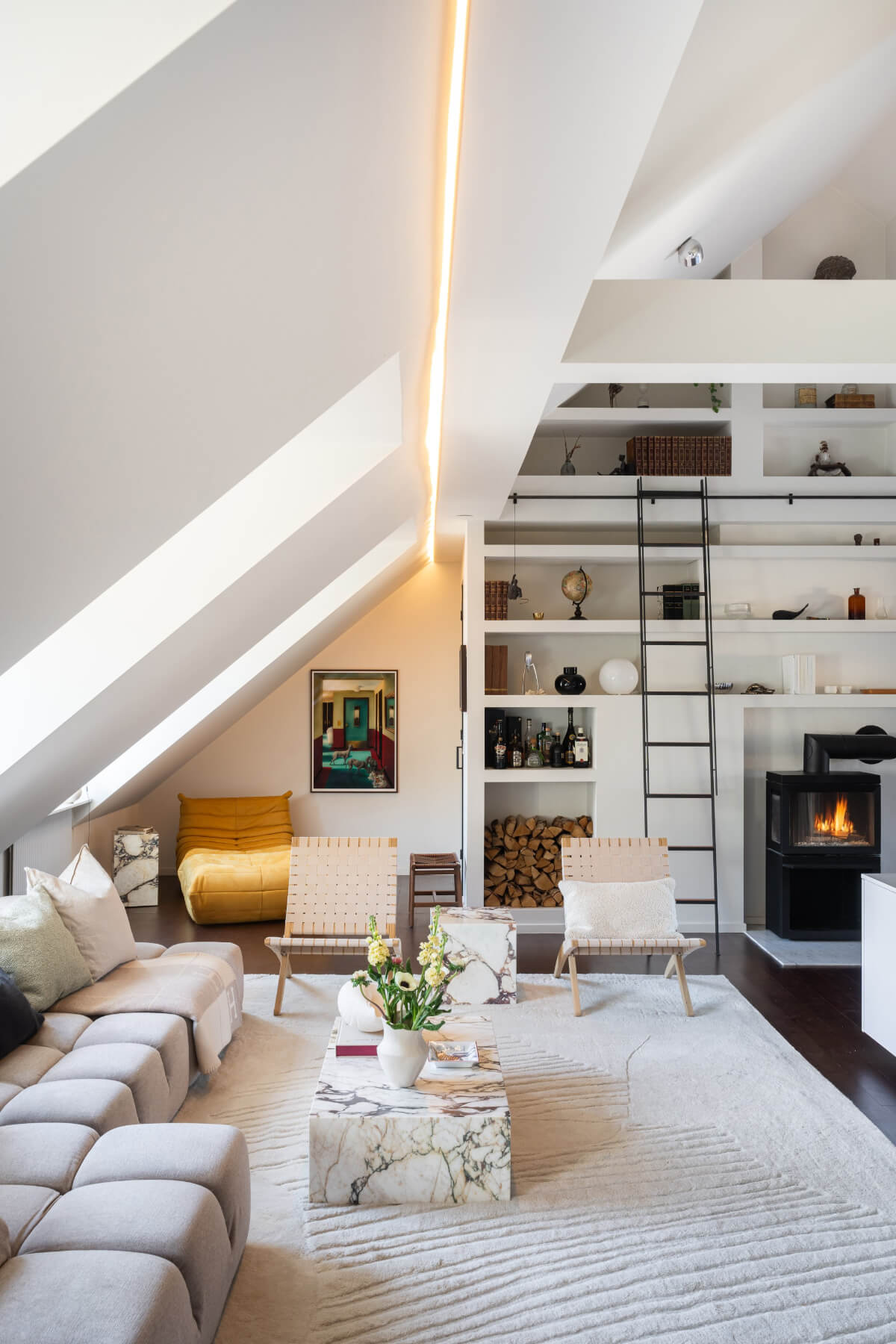 light attic living room floor to ceiling bookshelves