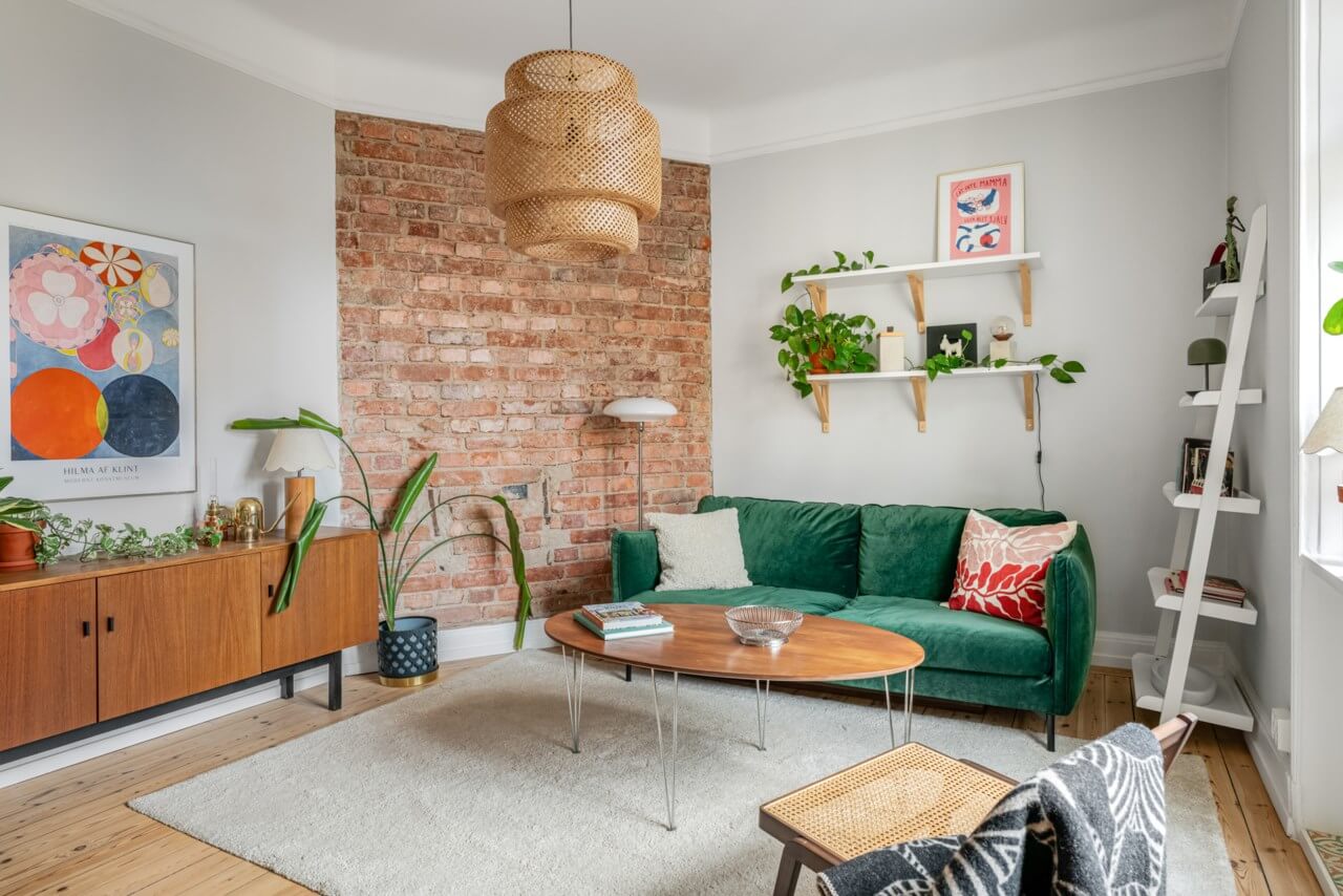 A Small Light-Filled Apartment with a Pink Bedroom 1 light living room exposed brick wooden floor