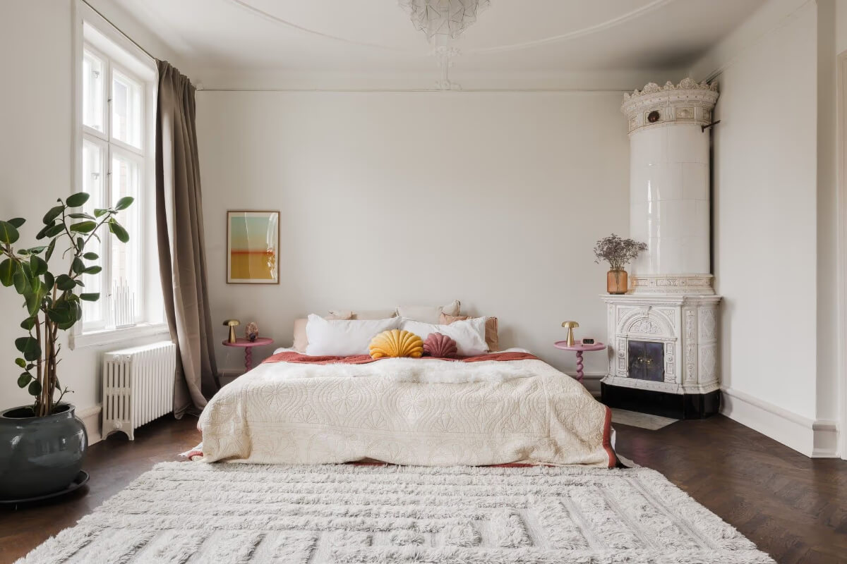 Grand Rooms and Period Features in a Malmö Apartment 17 light spacious bedroom with fireplace