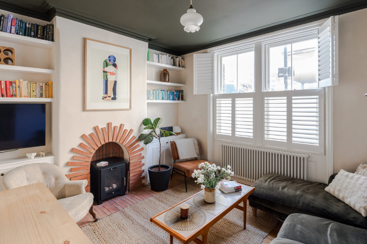 Contemporary Design in a Victorian Ground Floor Apartment 2 living room dark green ceiling terracotta bricks fireplace