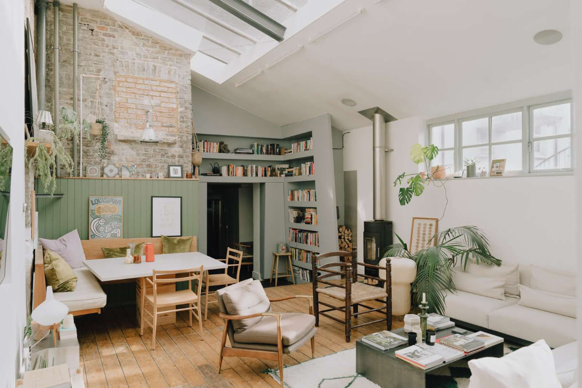 A London Basement Apartment in a Former Wood Workshop 1 living room pitched roof built-in table bench