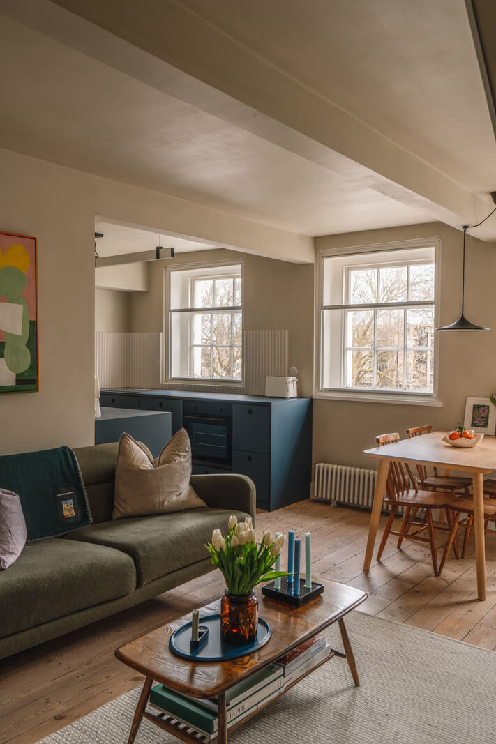Contemporary Interiors in a Georgian Duplex Apartment in London 2 living room plaster walls wooden floorboards blue kitchen