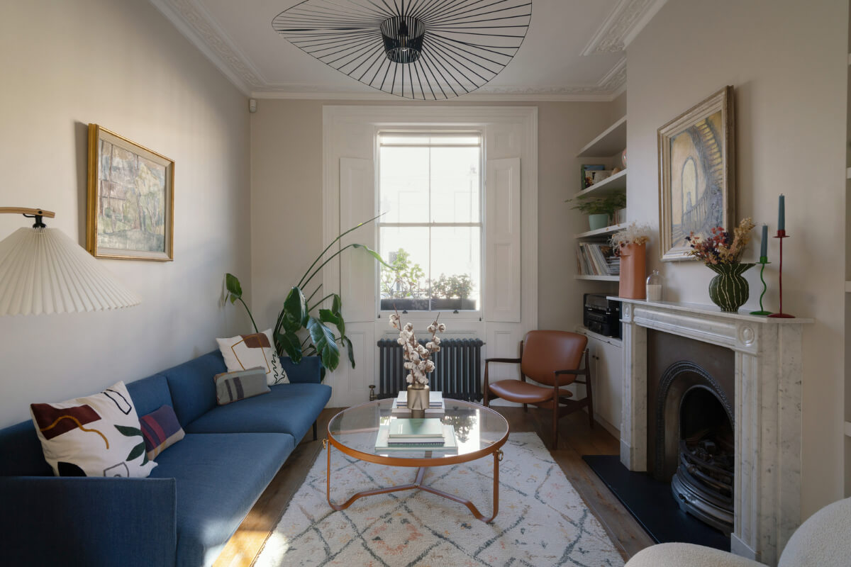 Contemporary Interiors and Preserved Details in an Early Victorian House 1 living room sash window box shutters fireplace