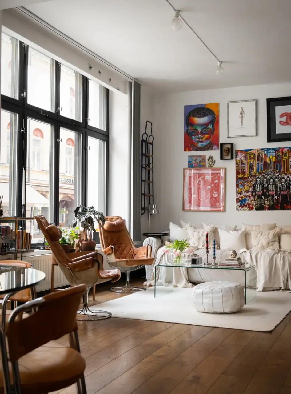 An Apartment with a Mirror Wall in a Former Stockholm Factory 2 living room warm wooden floor