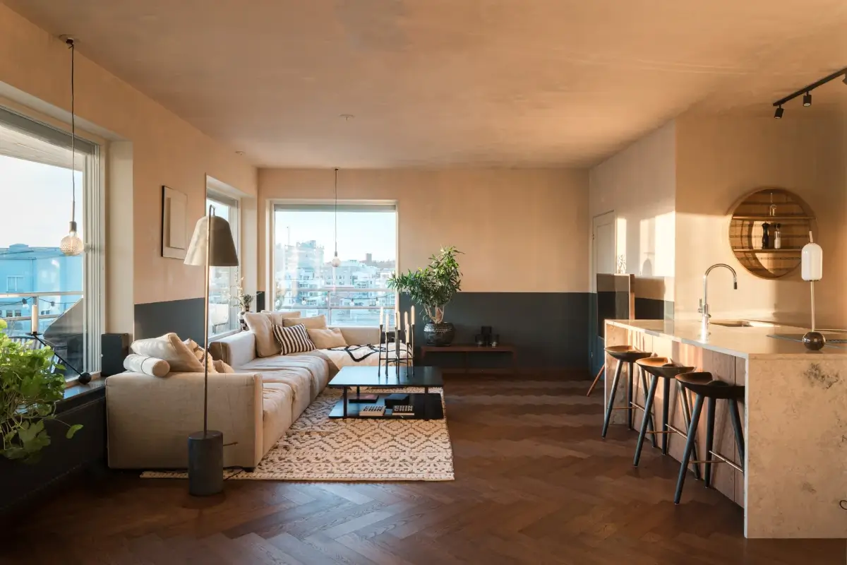 A Top Floor Swedish Apartment with a Huge Balcony 1 open plan living room two tone wall herringbone floor