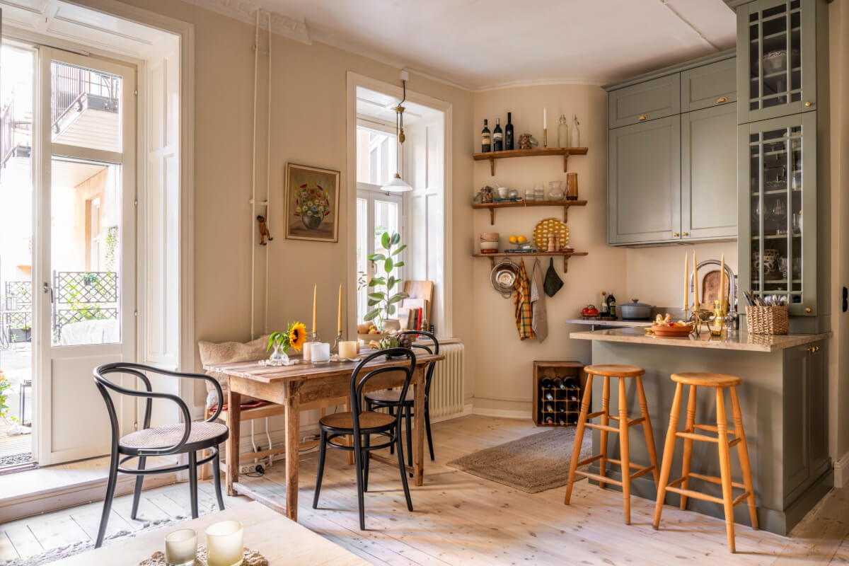 A Cozy Small Apartment with Period Features and Lots of Storage 7 open plan living space wooden table small kitchen