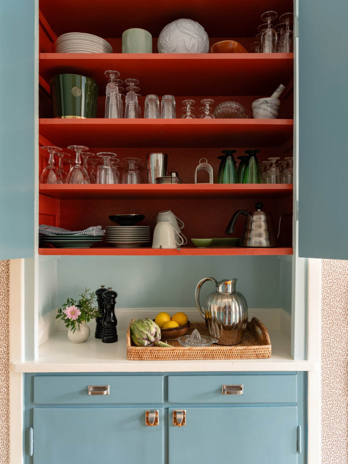 A Beautiful Well-Preserved 1930s Apartment with a Blue Kitchen 4 orange painted kitchen cabinet interior