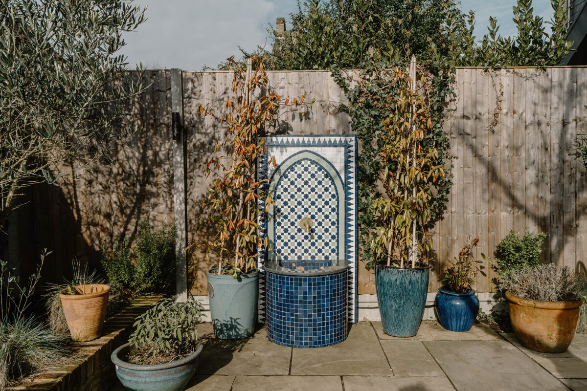 Moroccan-Inspired Designs in a Unique Artist Family Home in London 36 paved garden fountain