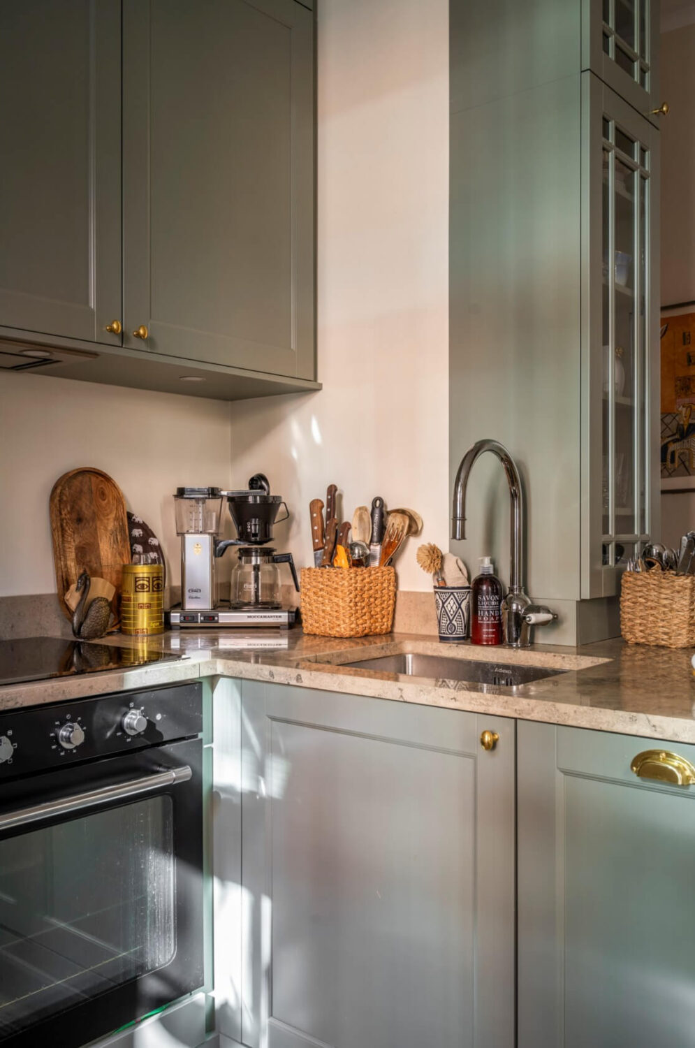 A Cozy Small Apartment with Period Features and Lots of Storage 11 small kitchen brass handles